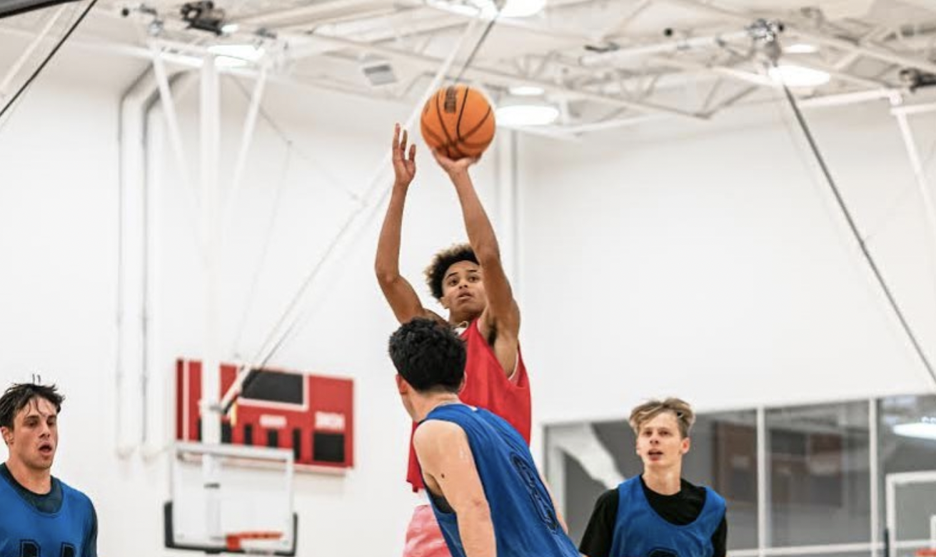 A basketball player taking a shot